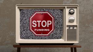 Old TV with Stop Funding Sign